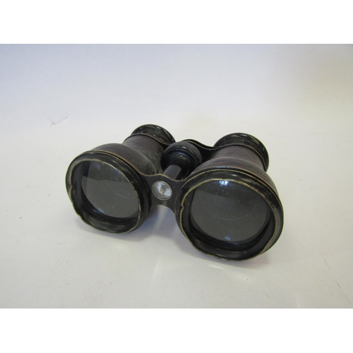 1345 - A pair of leather covered binoculars with built-in compass, no case