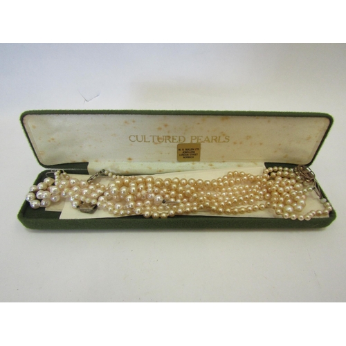 1347 - Two double strand necklaces of cultured pearls, one having a 9 carat gold clasp, and a bracelet