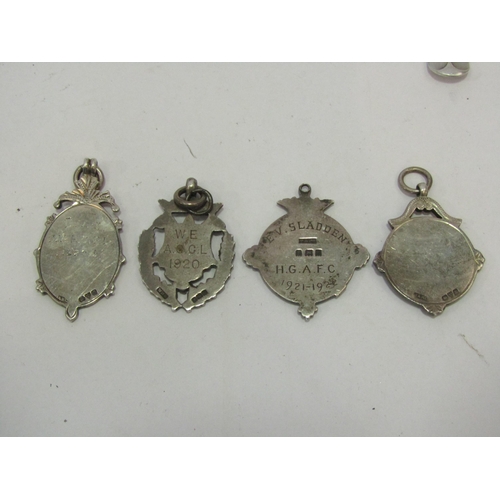 1350 - A small selection of silver items including pepperettes, coffee spoons and watch fobs