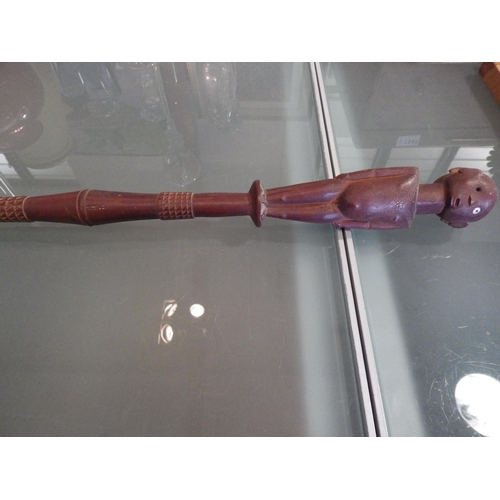 1546 - An African carved hardwood walking cane, double-sided design of man and woman, 104cm long