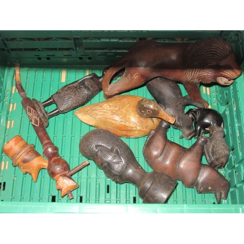 1229 - A collection of wood carvings including lion, warthog, pipe, rhino (a/f) etc.