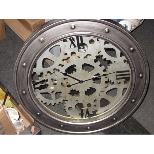 1237 - A battery operated wall clock with silvered frame, 60cm diameter