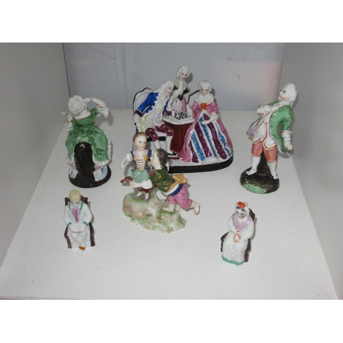 1427 - A collection of hard paste porcelain figural groups, couple playing chess, dancing couple and miniat... 