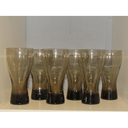 1299 - A set of six smoked glass fluted drinking glasses