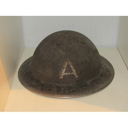 1445 - An air raid warden's helmet. Original paint and interior liner