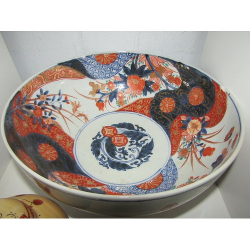 1456 - An Oriental Imari palette footed bowl, 28cm diameter, and an Oriental jar and cover (2)