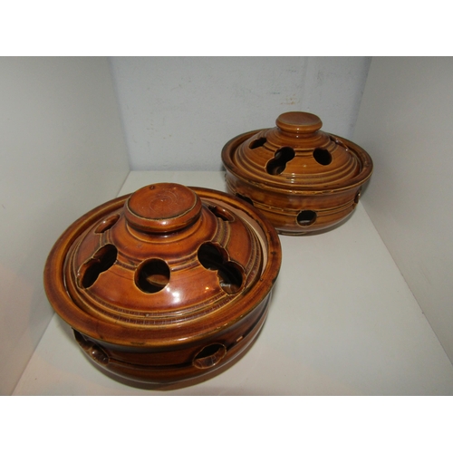 1460 - A pair of treacle glazed lidded garlic pots