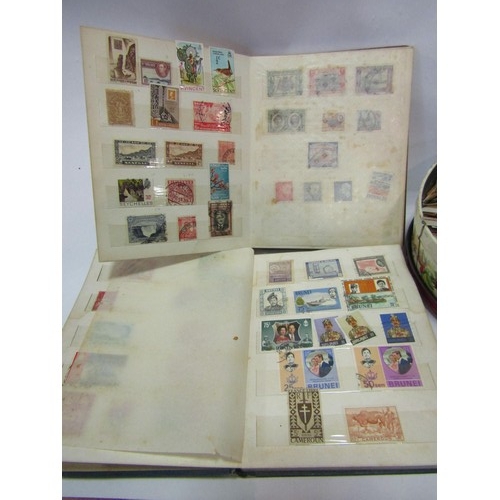 1319 - Four stamp albums with contents and a tin of loose stamps