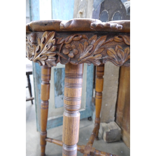 2004 - A late Victorian occasional carved oak table with thistle design