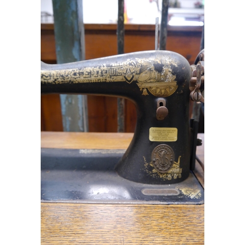 2006 - A Singer sewing machine on cast iron base