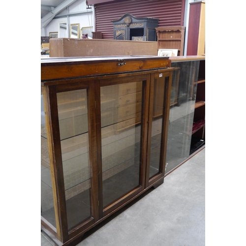 2394 - An oak glazed cabinet