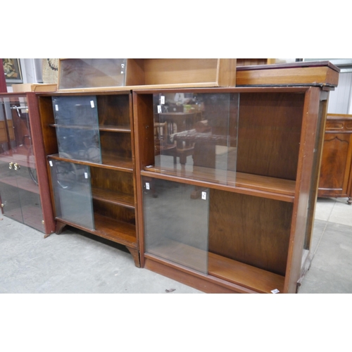 2400 - Two mid-century sliding door bookcases