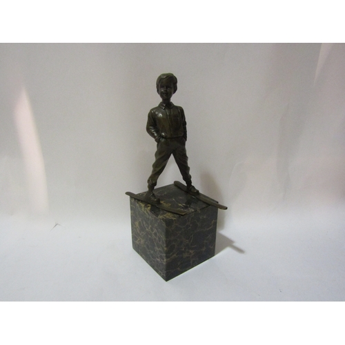 4027 - A bronze boy on ski's mounted on marble plinth, after Preiss, 29cm tall