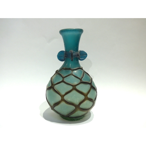 4075 - A Continental Art glass vase in turquoise with overall web casing, 28cm tall