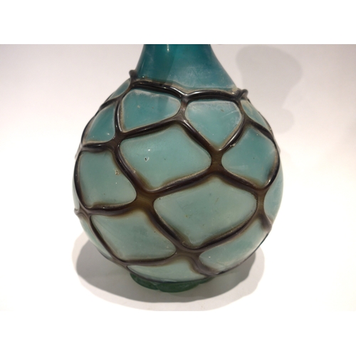 4075 - A Continental Art glass vase in turquoise with overall web casing, 28cm tall