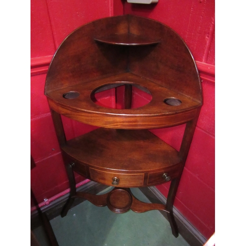 4141 - A George III mahogany three tier corner washstand the raised back with shelf over a single drawer an... 