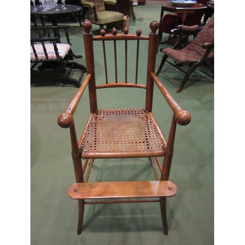 4143 - Circa 1840, a child's elm and fruitwood faux bamboo high back chair with brass stud & turned spheric... 