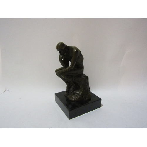 4155 - A bronze study of The Thinker after Rodin, on marble base, 14cm tall