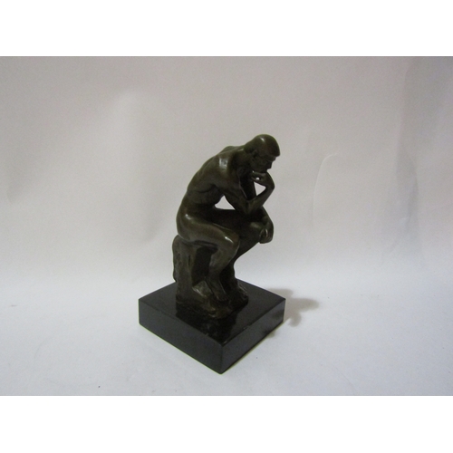 4155 - A bronze study of The Thinker after Rodin, on marble base, 14cm tall