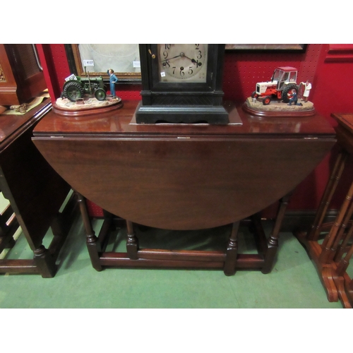 4193 - Circa 1900 stamped R. Horner an Edwardian mahogany oval top gate leg table, the rising leaves over t... 