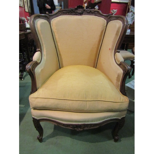 4201 - A French 19th Century walnut fauteuil armchair with carved decoration over a serpentine front seat o... 