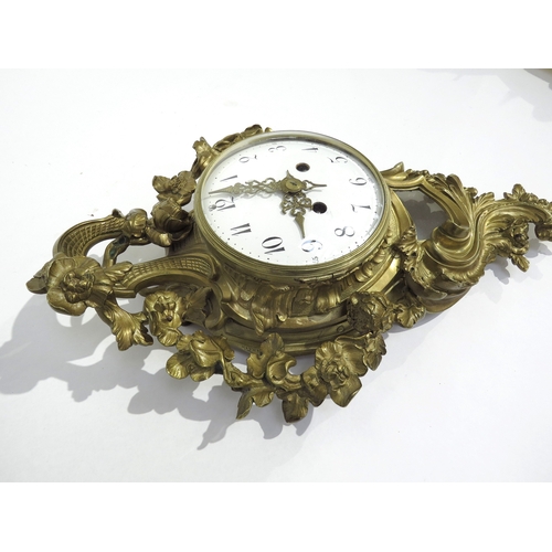 8075 - A gilt metal Rococo style cartel wall clock, with floral design, white Arabic numeral dial with oute... 