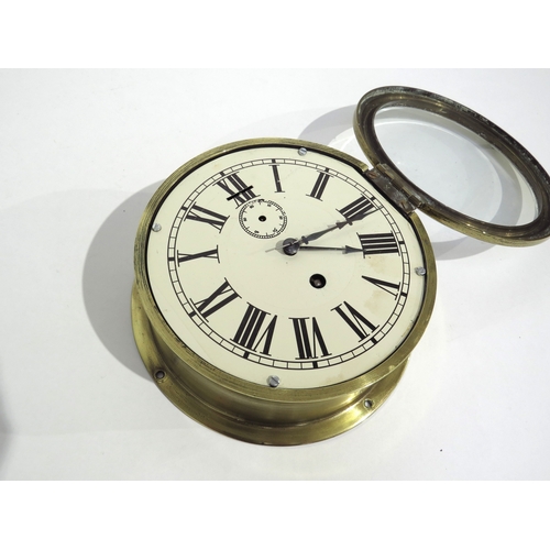 8077 - A brass cased ships clock with Roman numeral dial, subsidiary dial below 12, missing hand