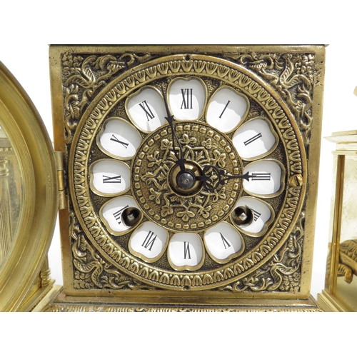 8099 - A small 21st Century ornate brass mantel clock. movement signed Franz Hermle (R for 2005), striking ... 