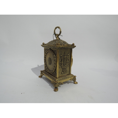 8099 - A small 21st Century ornate brass mantel clock. movement signed Franz Hermle (R for 2005), striking ... 