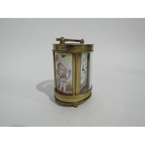 8109 - A miniature French oval brass cased carriage timepiece, coloured enamel panels to sides depicting Ch... 