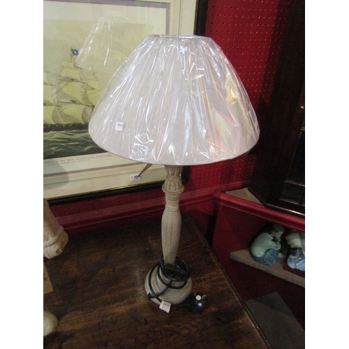 4043 - A pair of turned slender column table lamps with linen shades, 61cm tall