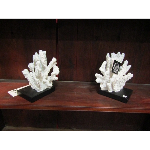 4142 - A pair of India Jane faux coral book ends