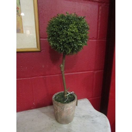 4169 - A pair of faux boxwood trees in pots, 56cm tall