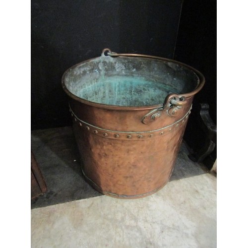 4172 - A rivetted copper bucket, 35cm diameter