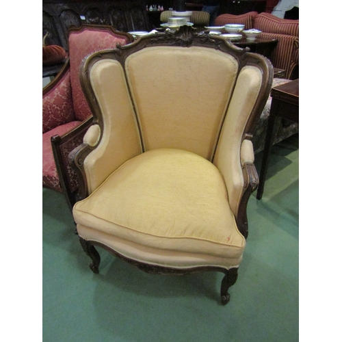 4201 - A French 19th Century walnut fauteuil armchair with carved decoration over a serpentine front seat o... 