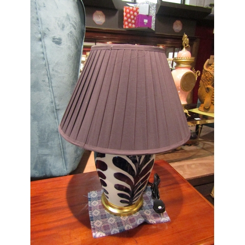 4218 - A Parian ceramic table lamp with cobalt blue palm effect decoration with black pleated shade