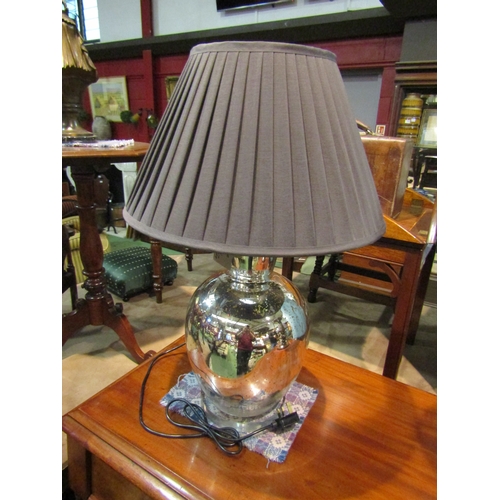 4220 - A mirrored baluster form table lamp with black pleated shade