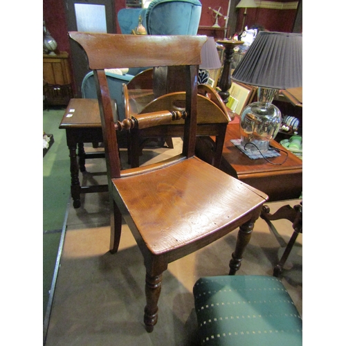 4222 - A circa 1830 pair of 'East Anglian' elm chairs with turned cross rail over a dished seat on turned a... 