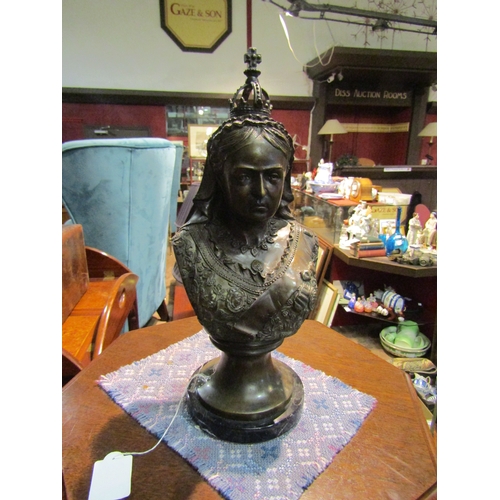 4225 - A bronzed bust of Queen Victoria on circular marble base, 42cm tall