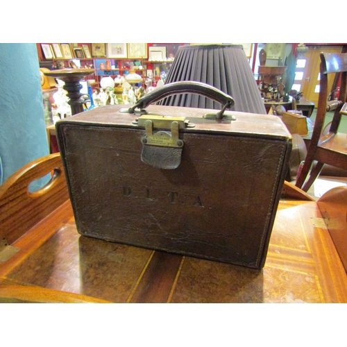 4228 - A solicitors leather case monogrammed D.I.T.A to the front, brass lock stamped 'The Exchange, Tho’s ... 