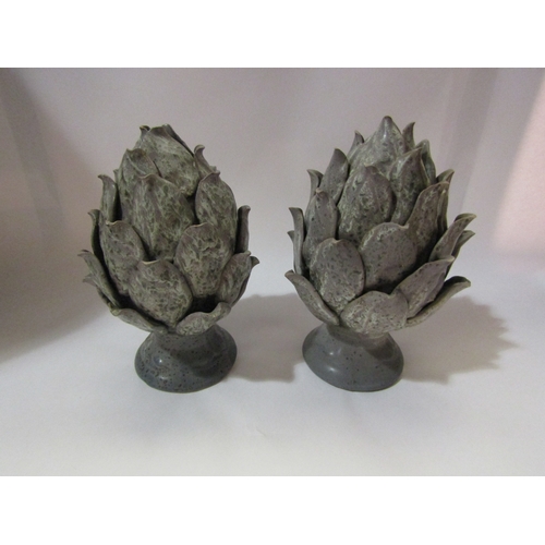 4261 - A pair of ceramic artichoke finials, 25cm tall