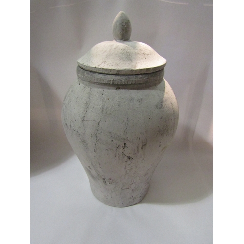 4269 - A 20th Century terracotta jar and cover painted grey, 48cm tall