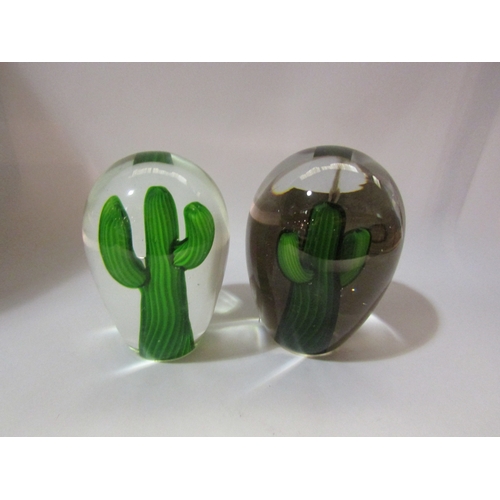 4274 - A graduated pair of Victorian style dumps each with cactus, 18cm and 17cm tall