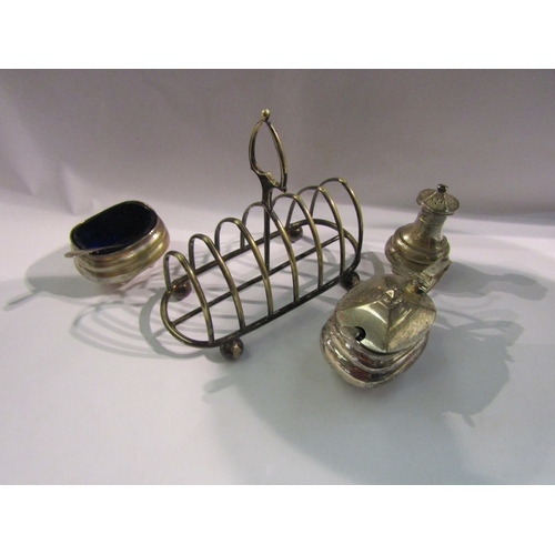 4304 - A 20th Century silver three-piece cruet set in the 18th Century style and a silver plated toast rack... 