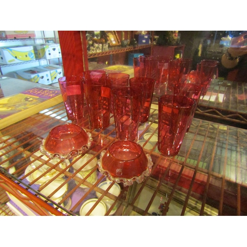 4341 - A set of eight Edwardian cranberry glass slender tumblers and a pair of late Victorian cranberry gla... 