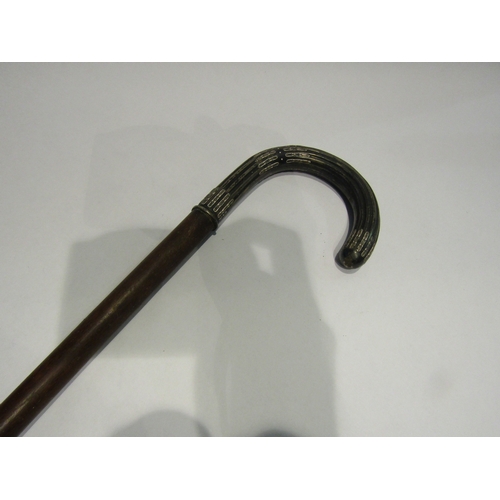 4356 - An early 20th Century walking cane with white metal handle