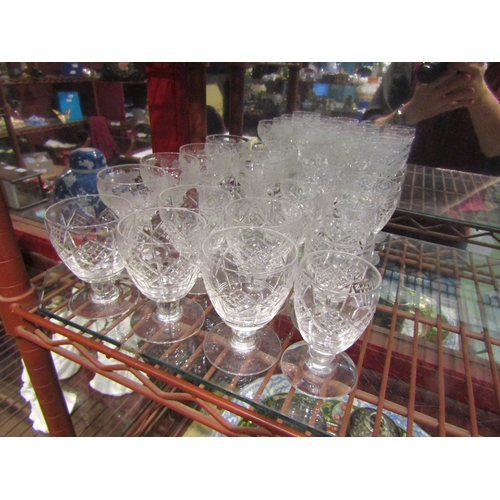 4359 - A set of fourteen cut glass short-stemmed glasses and a set of six similar glasses (20)