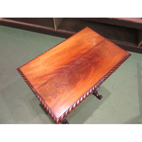 4005 - Circa 1840, a flame mahogany sewing table the internal mirror rising lid with key and fitted interio... 