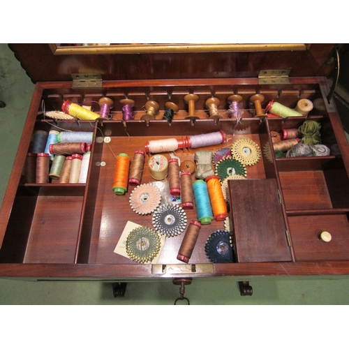 4005 - Circa 1840, a flame mahogany sewing table the internal mirror rising lid with key and fitted interio... 