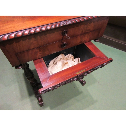 4005 - Circa 1840, a flame mahogany sewing table the internal mirror rising lid with key and fitted interio... 